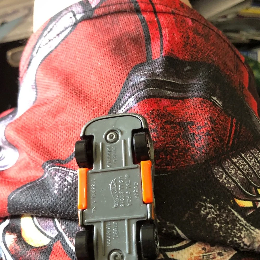 Small Gray Toy Car with Orange Interior